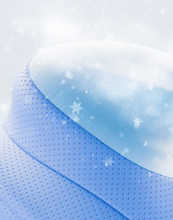 Blue perforated pillow side with a cooling snowflake-style surface
